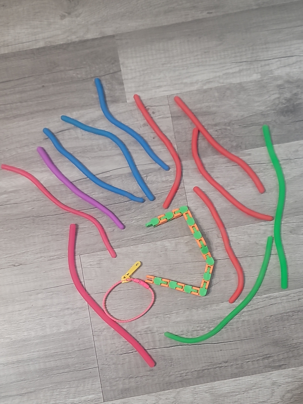 Fidget Set Includes 12 Monkey Noodles,  1 Zipper Bracelet, And 1 Wacky Track